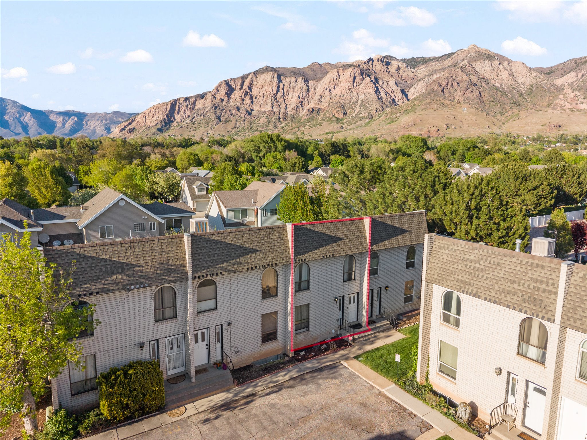 View of mountain backdrop with nearby suburban area