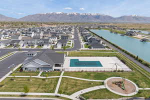 Aerial view of community pool, clubhouse and playground