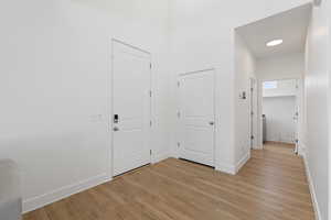 Entryway featuring high ceilings and LVP flooring