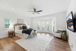 Bedroom featuring french doors, light wood-style floors, access to exterior, ceiling fan, and recessed lighting