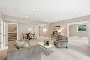 Living room featuring light carpet and recessed lighting
