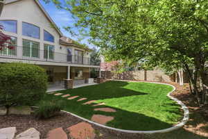 Fenced backyard featuring a patio area