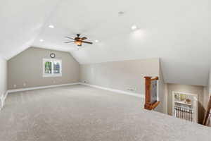 Bonus room featuring light colored carpet, a ceiling fan, and recessed lighting