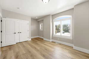 Foyer entrance with light wood finished floors