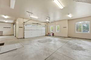 Garage featuring baseboards