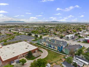 Aerial perspective of suburban area featuring a mountain backdrop