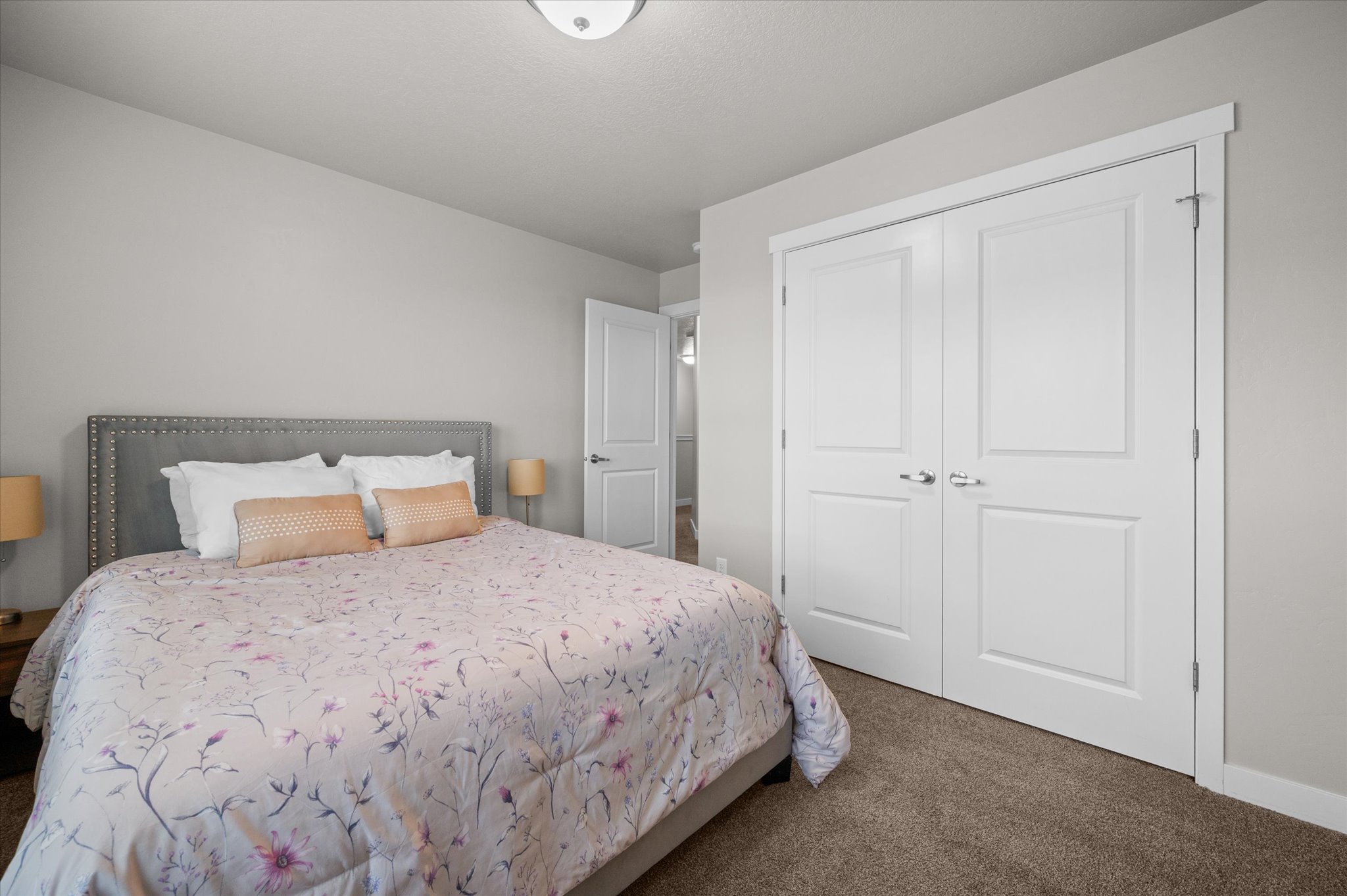Bedroom featuring dark carpet and a closet
