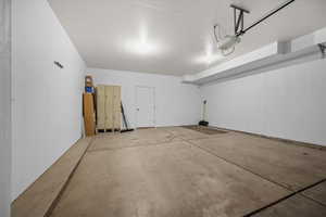 Garage featuring a garage door opener