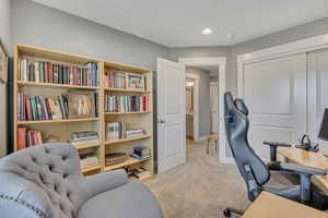 Office space featuring light carpet and baseboards