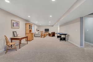 Rec room featuring light colored carpet, recessed lighting, and pool table