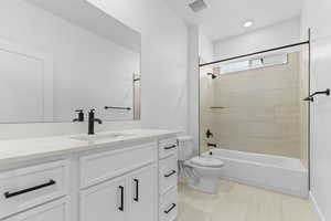 Full bath featuring vanity and shower / bathtub combination