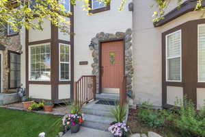 Entrance to property featuring stucco siding