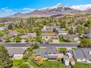 Aerial view of residential area featuring mountains