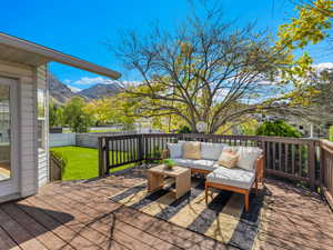 Deck featuring an outdoor hangout area and a mountain view