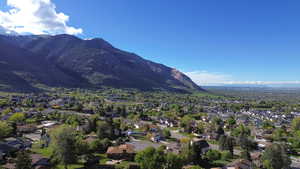 View of mountain background featuring nearby suburban area