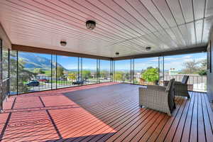 Unfurnished sunroom featuring a mountain view