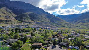 Aerial perspective of suburban area featuring a mountainous background