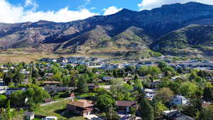 Aerial view of residential area featuring a mountain backdrop