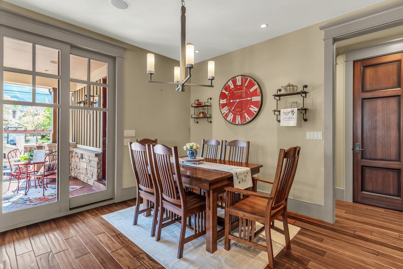 Dining area with wood floors and hanging lights
