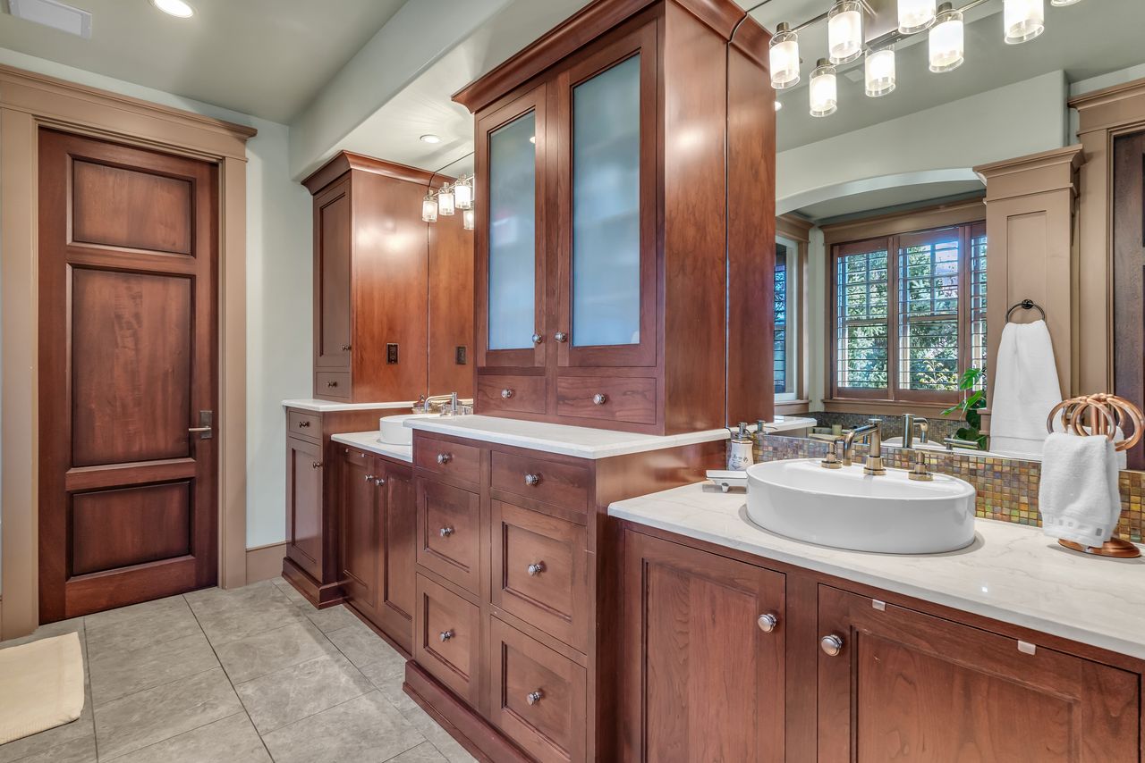 Primary bathroom with double vanity, lots of storage and recessed lighting