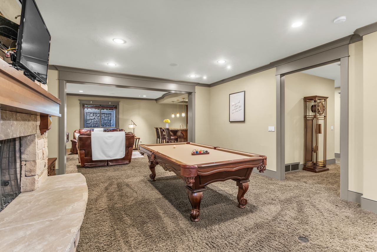 Recreation room with carpet flooring, a fireplace, recessed lighting, billiards, and crown molding