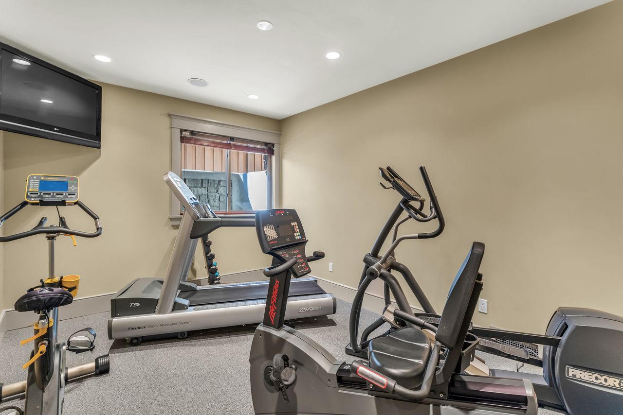 Exercise area featuring recessed lighting most equipment included!
