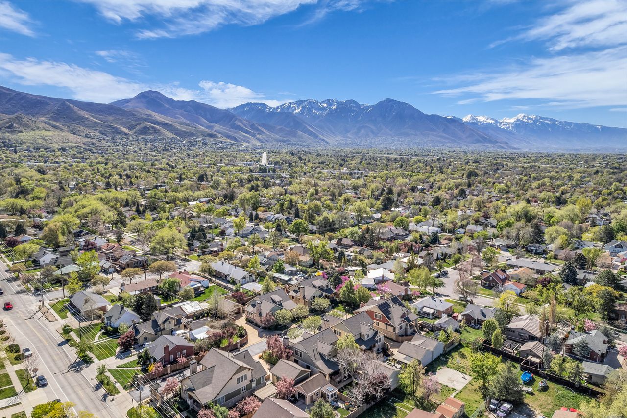 Aerial perspective of suburban area with a mountainous background