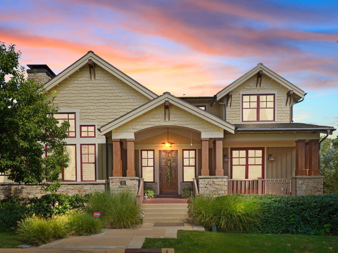 Craftsman house with stone siding and covered porch
