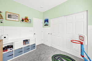 Rec room featuring light carpet