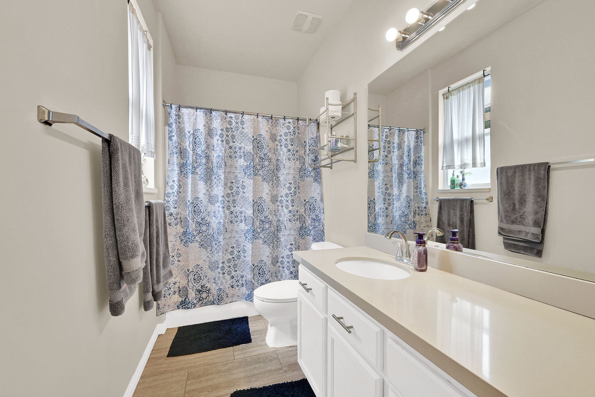 Full bathroom featuring vanity and toilet