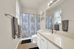 Full bathroom featuring vanity and toilet