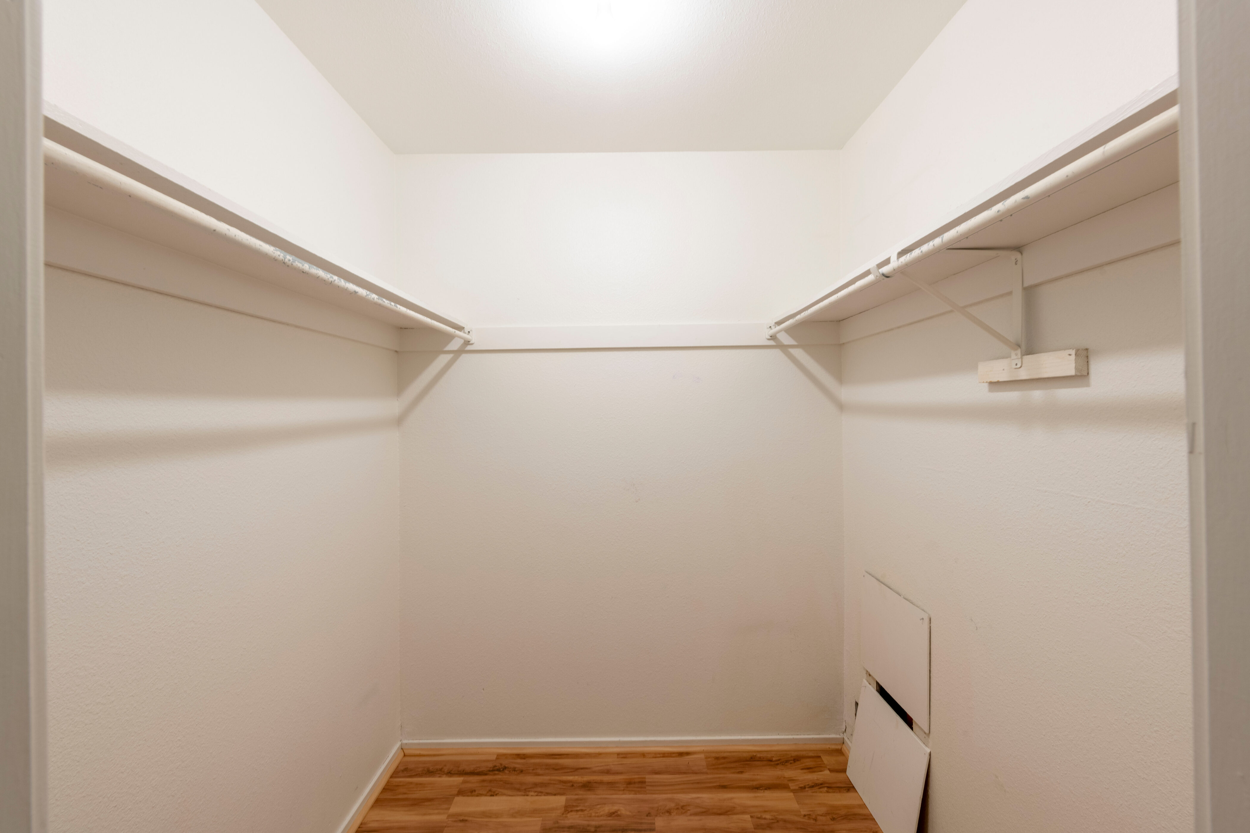 Walk in closet featuring light wood-style flooring