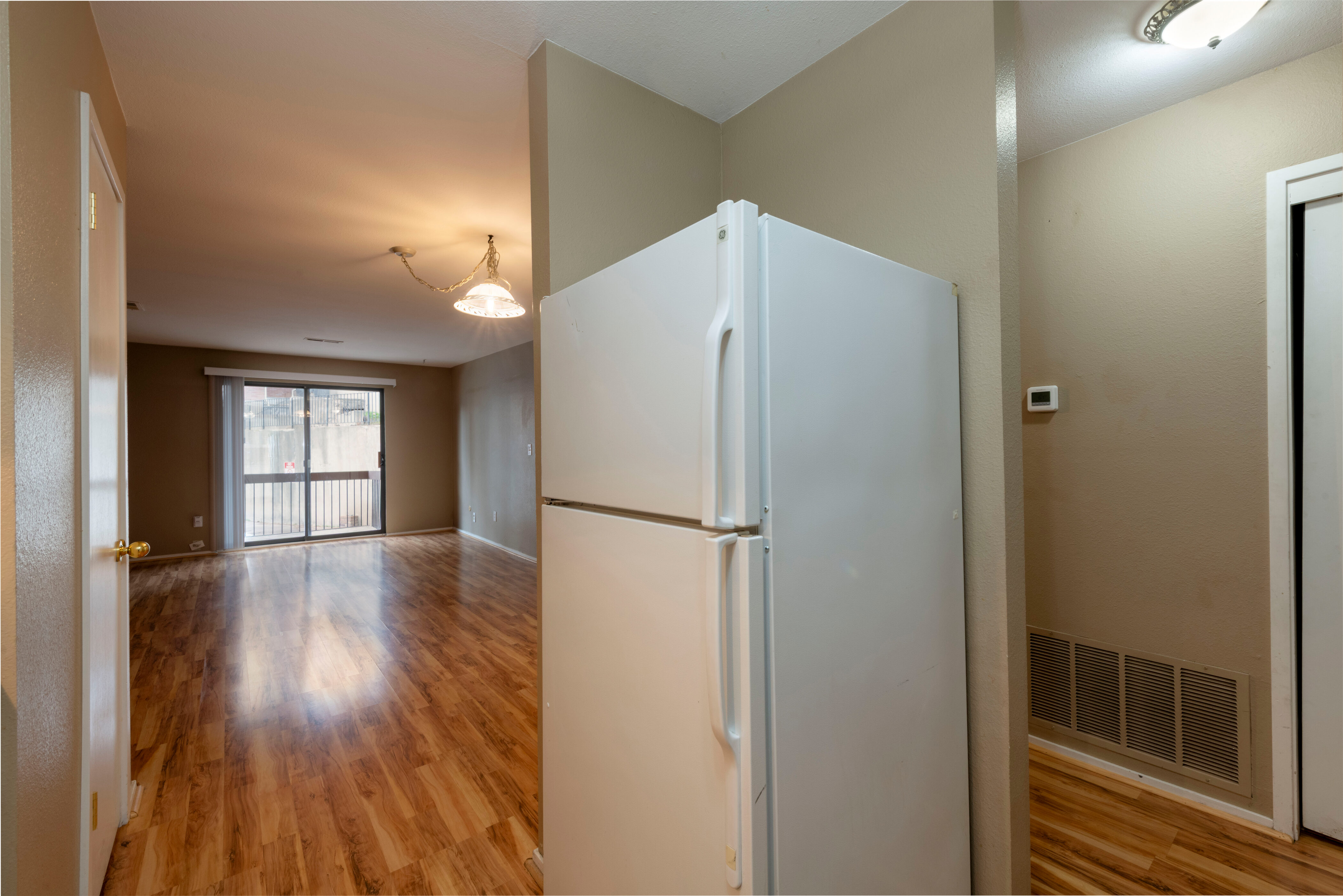 Kitchen featuring freestanding refrigerator and light wood-type flooring