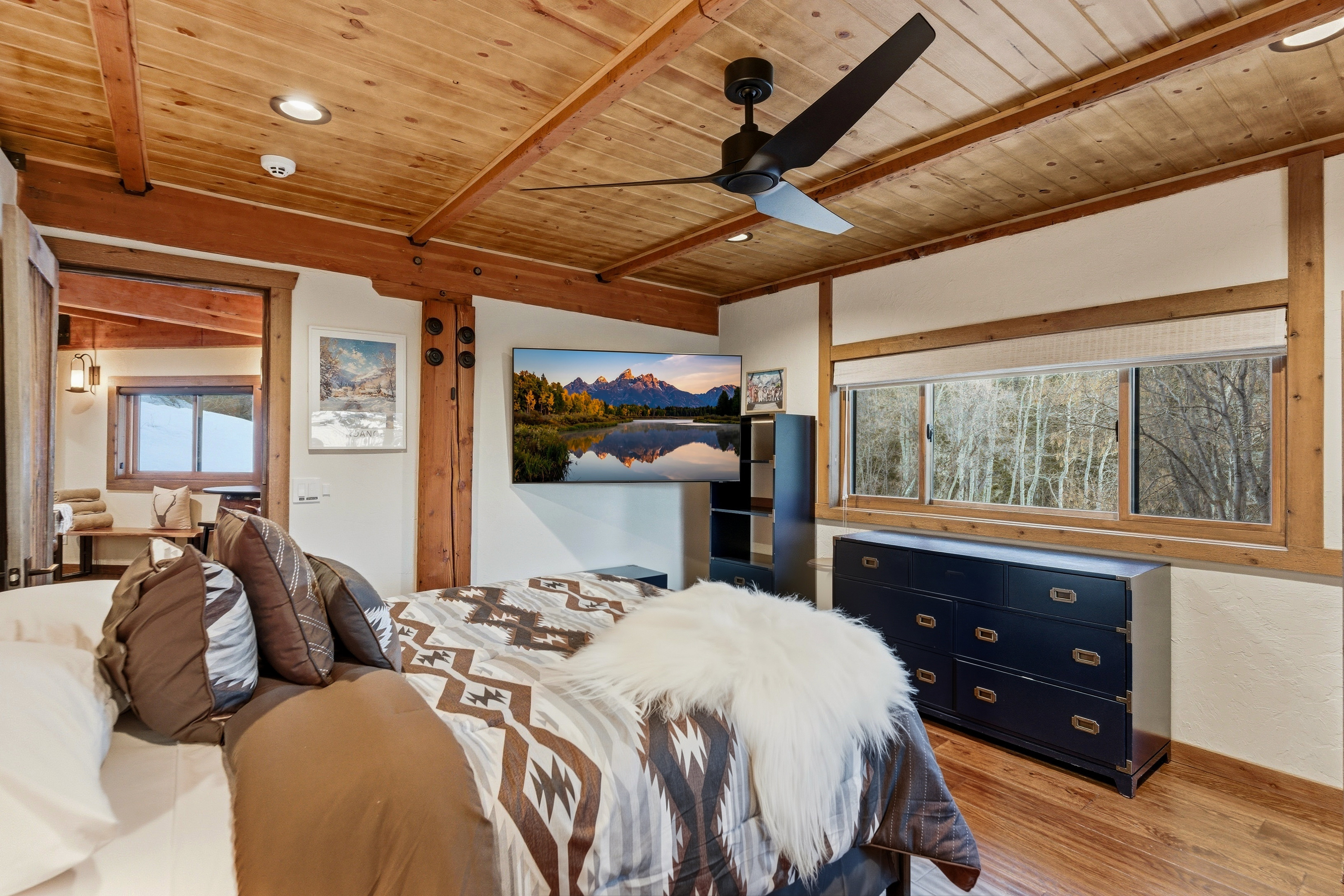 Bedroom with recessed lighting, ceiling fan, wood finished floors, and a wood ceiling with exposed beams
