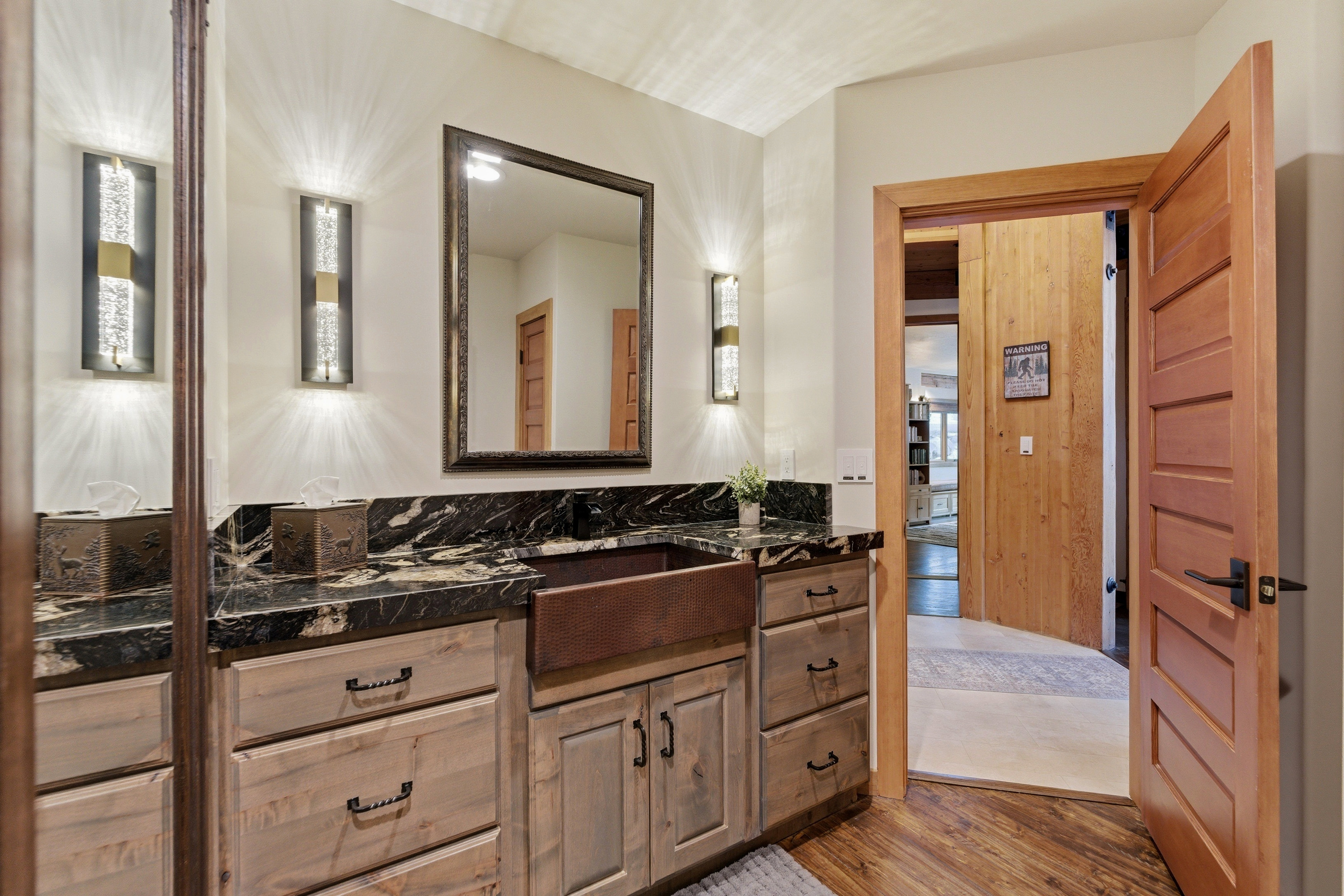 Bathroom featuring vanity and light wood-type flooring