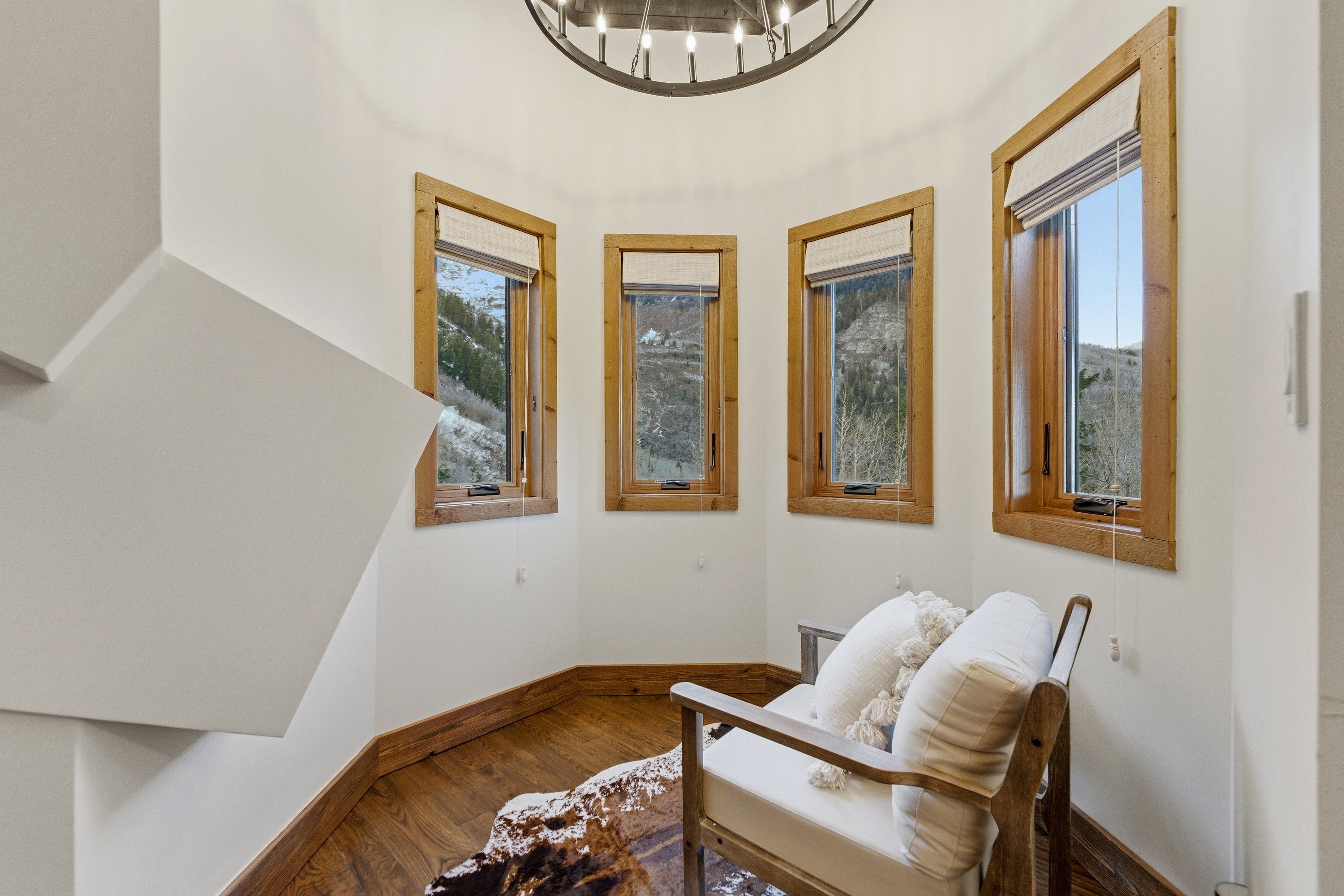 Sitting room with baseboards and wood finished floors