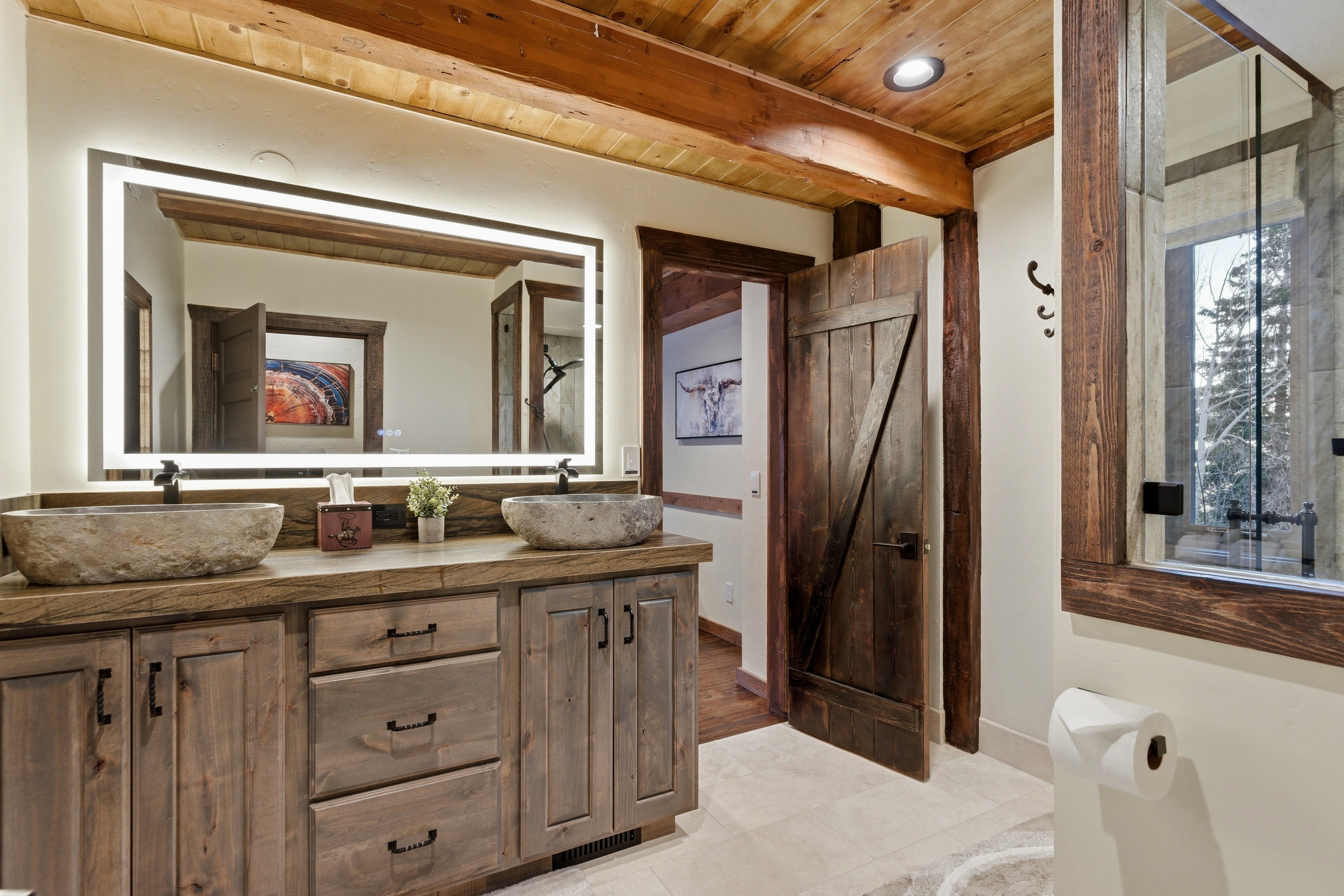 Full bathroom with double vanity, a wood ceiling with exposed beams, light tile patterned floors, and recessed lighting