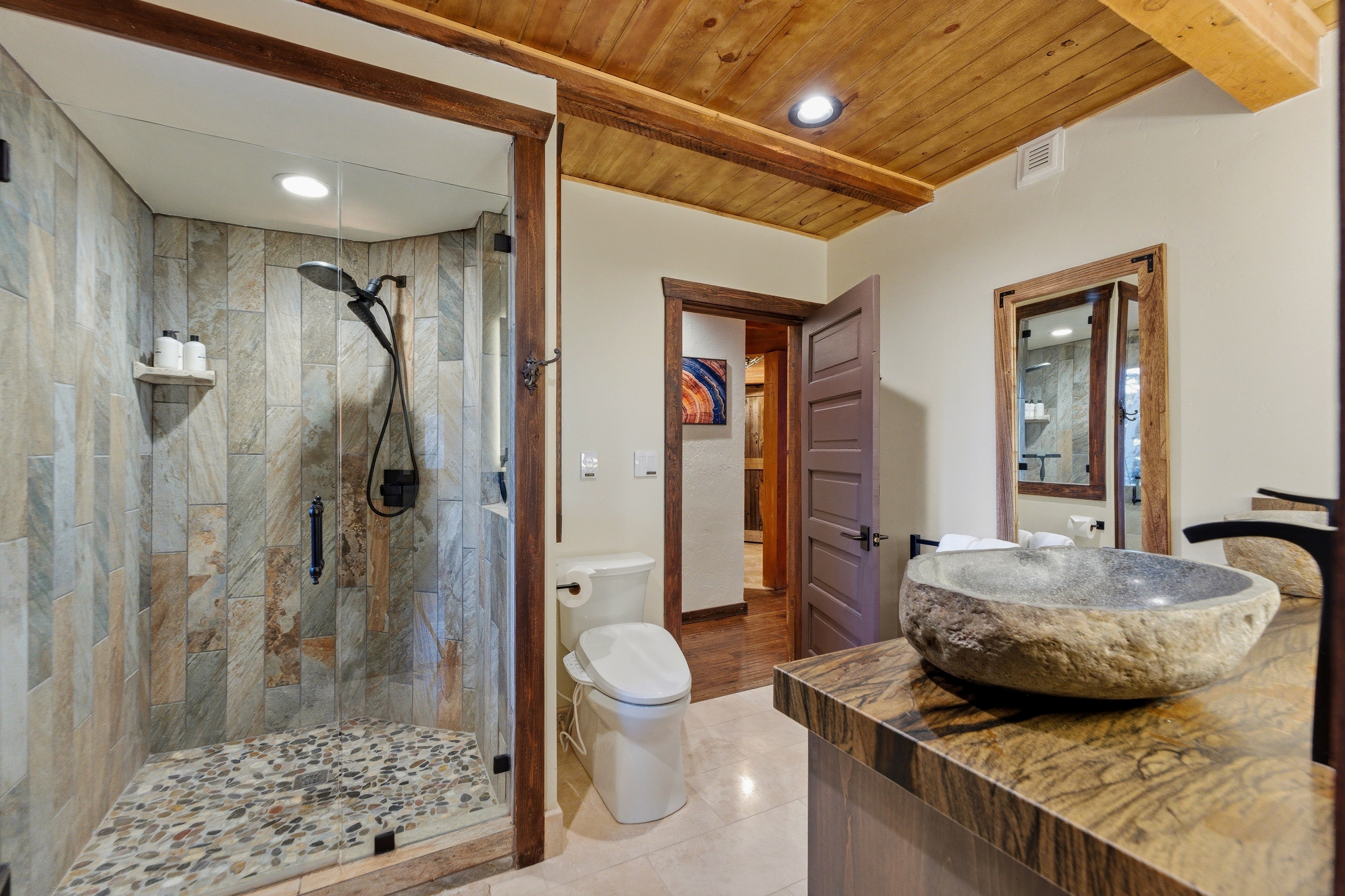 Bathroom with a stall shower, recessed lighting, vanity, light tile patterned floors, and wooden ceiling