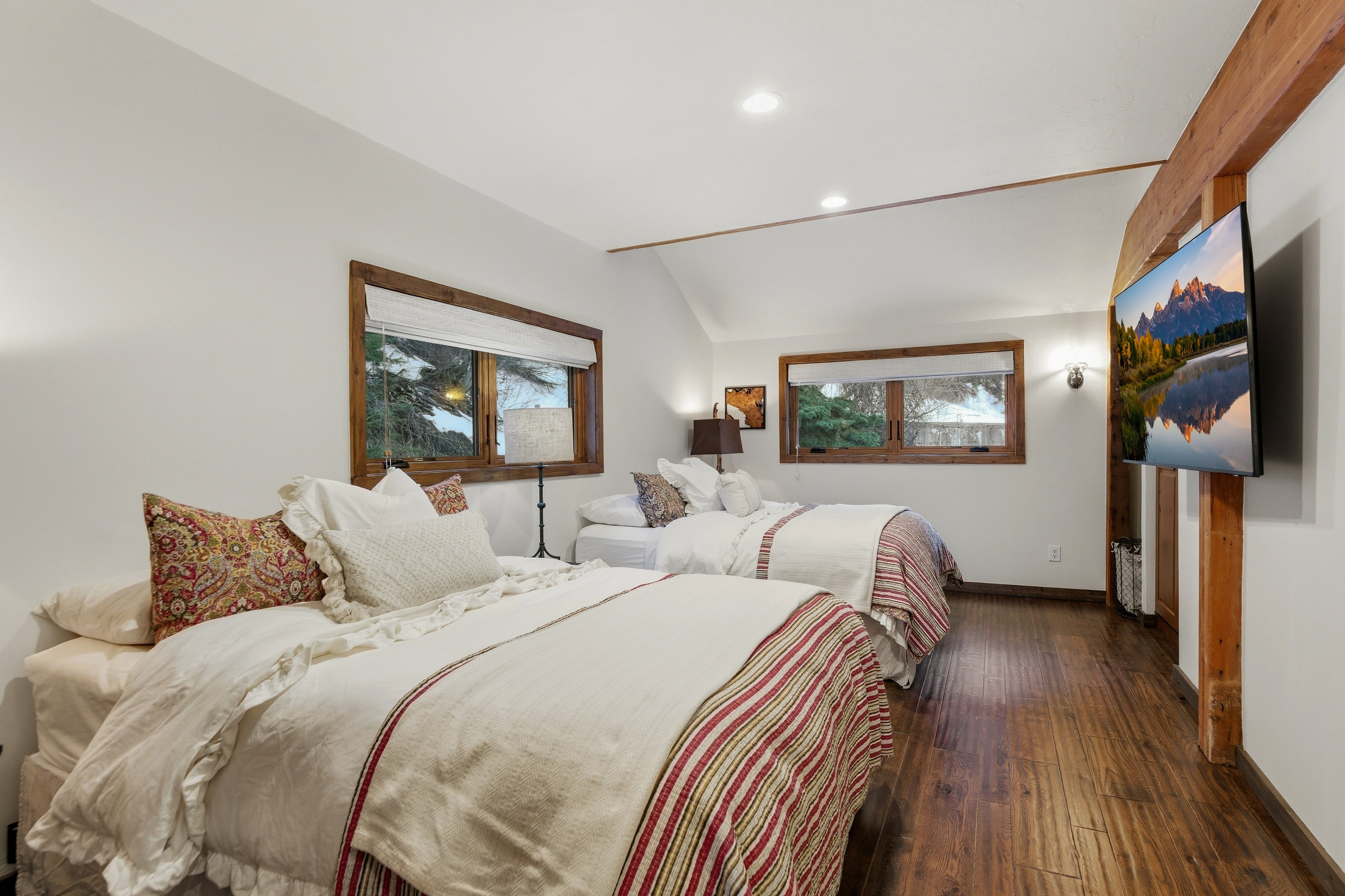 Bedroom with wood-type flooring, vaulted ceiling, and recessed lighting