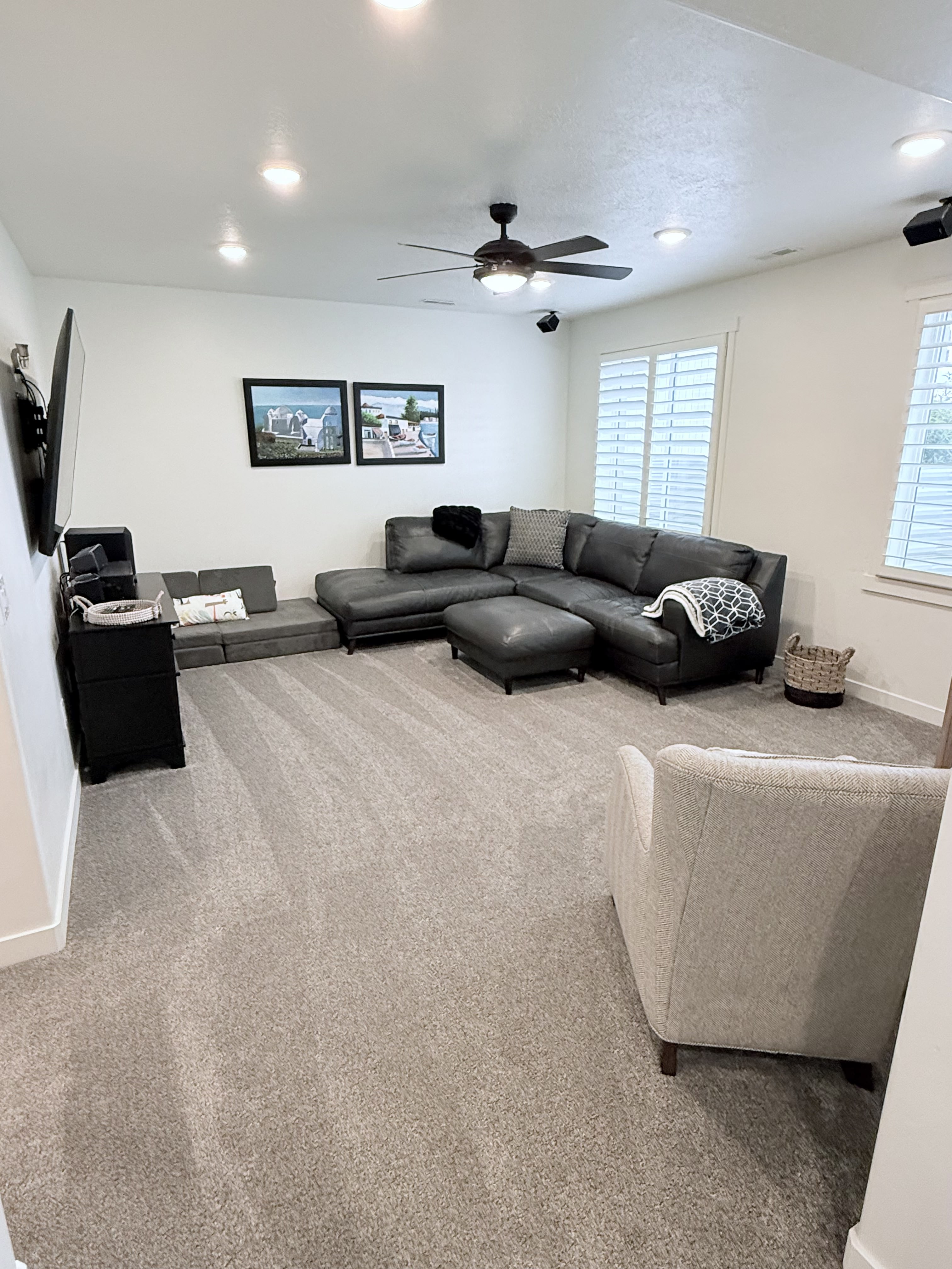 Living room with carpet, recessed lighting, and ceiling fan