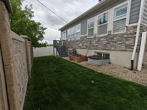 Fenced backyard with a garden