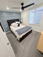 Carpeted bedroom featuring ceiling fan and recessed lighting