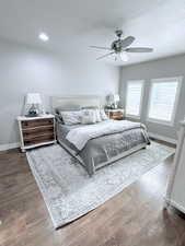 Bedroom featuring dark wood-style floors and a ceiling fan