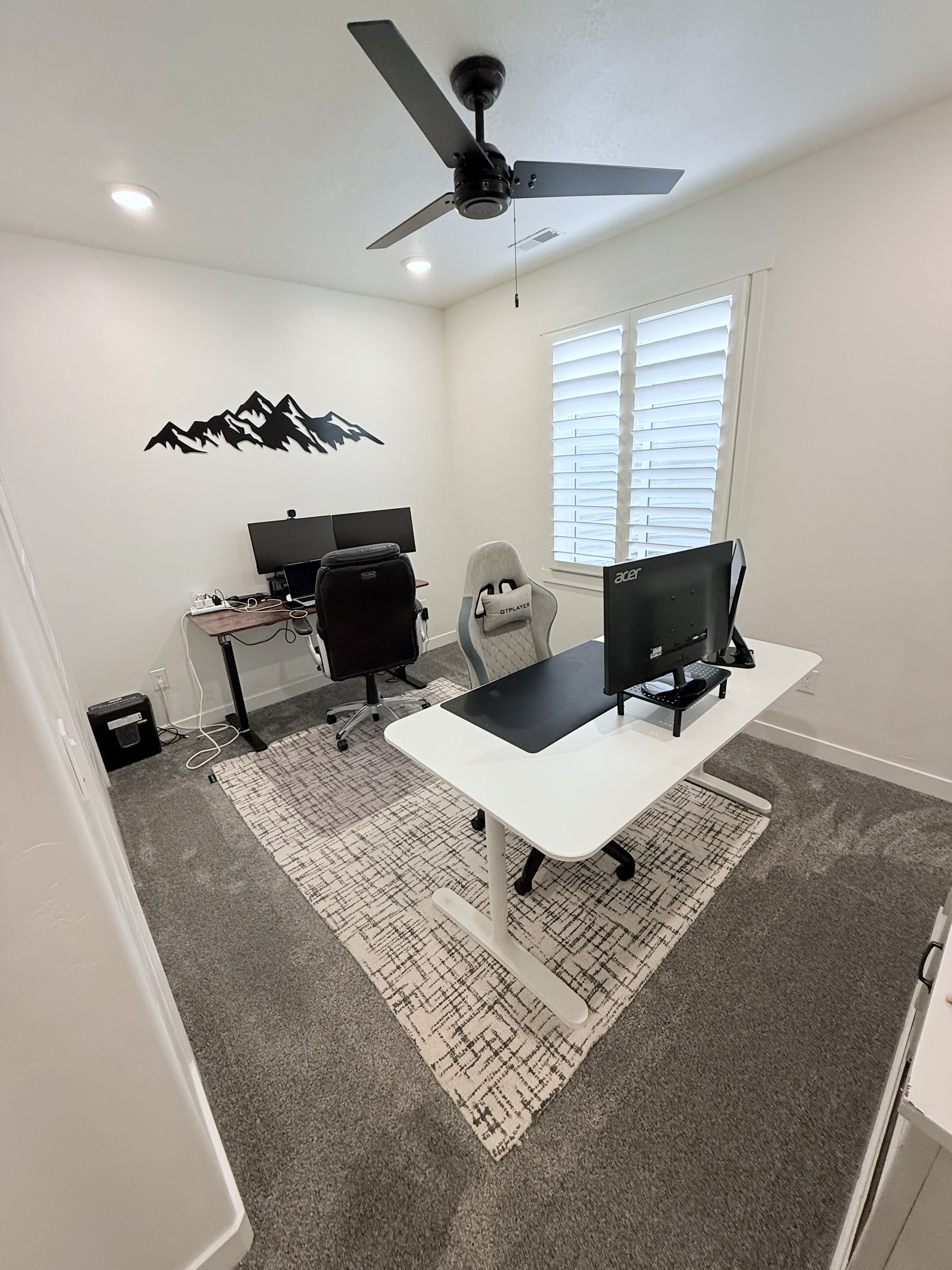 Carpeted home office with ceiling fan and recessed lighting