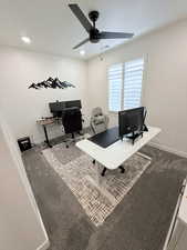 Carpeted home office with ceiling fan and recessed lighting