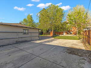 View of detached garage and extra parking