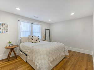 Bedroom featuring light wood-style floors and recessed lighting