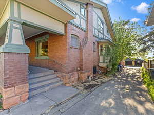 View of property exterior with brick siding