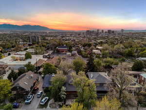 Aerial view at dusk of a view of city and a mountain view