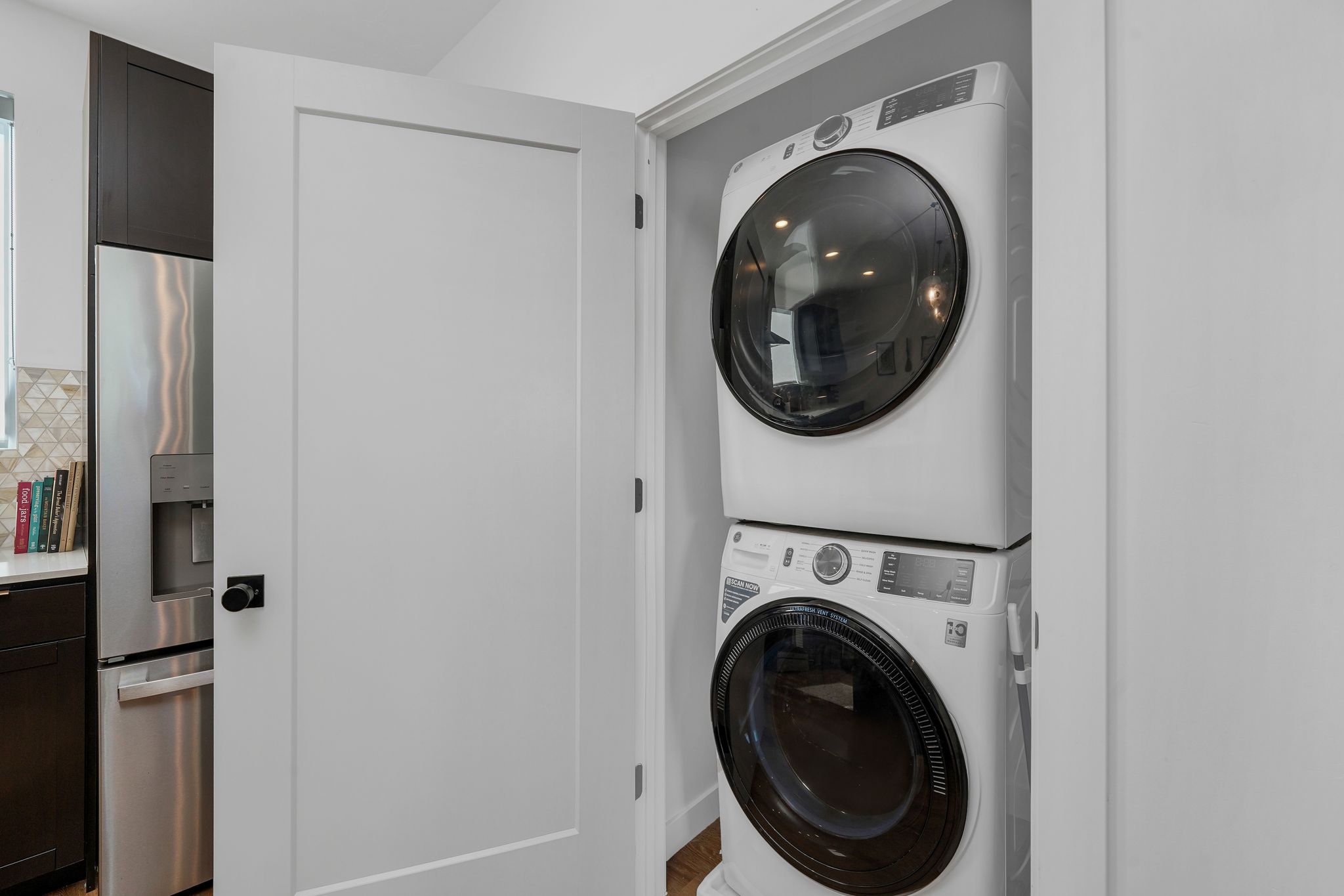 Laundry area featuring stacked washer / dryer